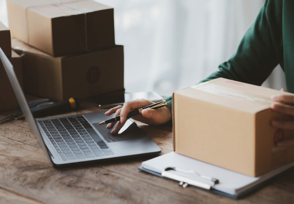 A person is using a laptop. Business owner opens an online store